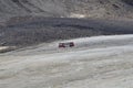 Ice Explorer Snow coaches on the Athabasca Glacier. Royalty Free Stock Photo