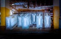 The Ice factory under working with industry machine which produce ices with ice factory background and sunlight rays background. Royalty Free Stock Photo