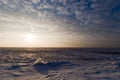 Ice field with setting sun Royalty Free Stock Photo