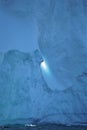 Close up melted hole in wall of iceberg