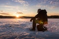 Ice fishing on a lake in Norway