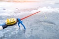 Ice fishing rod with the lure by the hole Royalty Free Stock Photo