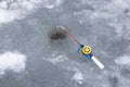 Ice fishing rod with the lure by the hole Royalty Free Stock Photo