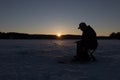 Ice fishing no a lake in Norway Royalty Free Stock Photo