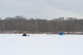 Ice Fishing Tents on a Frozen Lake