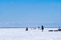 Ice Fishing. Winter fishing on ice at sea, Estonia.