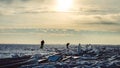 Ice fishing. Winter fishing on the lake. Silhouettes of fishermen on a winter fishing trip at sunset. Ice fishing on the lake Royalty Free Stock Photo