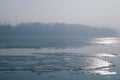 Ice floating in the river. Ice Break up. Sun reflection Royalty Free Stock Photo