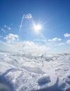 Ice floe and sun on winter Baikal lake Royalty Free Stock Photo