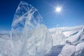 Ice floe and sun on winter Baikal lake Royalty Free Stock Photo