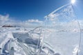 Ice floe and sun on winter Baikal lake Royalty Free Stock Photo