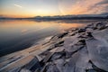 Ice floes on the lake shore. Colorful sky during sunrise on cold winter morning.Dam Liptovska Mara, Slovakia Royalty Free Stock Photo