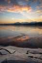 Ice floes on the lake shore. Colorful sky during sunrise on cold winter morning.Dam Liptovska Mara, Slovakia Royalty Free Stock Photo