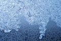 Ice flowers frozen blue window textured background. Royalty Free Stock Photo