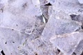 Ice fragments on frozen lake water level.