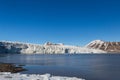 Ice front of Esmarkbreen glacier in summer, Spitsbergen, blue sky, sea