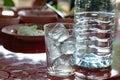 Ice glass and drinking water bottle, water glass and ice cubes Royalty Free Stock Photo