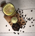 Ice Green Tea Coffee background with coffee beans in wood bowl Royalty Free Stock Photo