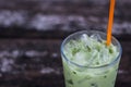 Ice green tea in glass on wood table. Royalty Free Stock Photo