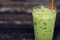 Ice green tea in glass on wood table. Royalty Free Stock Photo