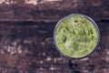 Ice green tea in glass on wood table top view. Royalty Free Stock Photo