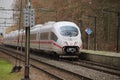 ICE high speed train between Arnhem and Utrecht at station Veenendaal-De Klomp in the Netherlands.