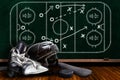 Ice Hockey Equipment and Chalk Board Play Strategy