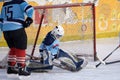 Ice hockey goalie in front of his net. Picture taken in ice arena. Royalty Free Stock Photo