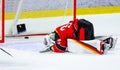 Ice hockey goalie heartbroken when he couldn`t catch the gold winning puck Royalty Free Stock Photo