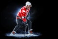 Ice hockey player isolated on black background Royalty Free Stock Photo