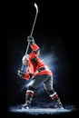 Ice hockey player isolated on black background Royalty Free Stock Photo