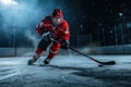 Ice hockey player at rink. Ice hockey player skating with stick and puck Royalty Free Stock Photo