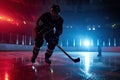 Ice hockey player at rink. Ice hockey player skating with stick and puck Royalty Free Stock Photo