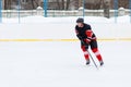 Ice hockey player with stick skating on the rink Royalty Free Stock Photo