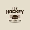 ice hockey puck logo vintage vector illustration template icon graphic design. winter sport club sign or symbol for tournament or Royalty Free Stock Photo