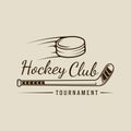 ice hockey puck and stick logo line art vintage vector illustration template icon graphic design. winter sport club sign or symbol Royalty Free Stock Photo