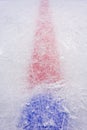 Ice of hockey rink cut by skates. Center face-off circle and red marker line. Royalty Free Stock Photo