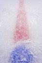 Ice of hockey rink cut by skates. Center face-off circle and red marker line. Royalty Free Stock Photo