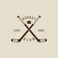 ice hockey stick and puck logo vintage vector illustration template icon graphic design. winter sport club sign or symbol for Royalty Free Stock Photo