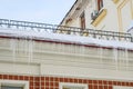 Ice icicles dangerously hanging from the roof