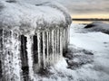 Ice icicles hanging down. Northern arctic winter season. Frozen nature. Retro or vintage style. Black and white image. Frozen