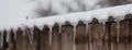 ice icicles on a snow-covered roof Royalty Free Stock Photo