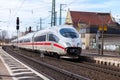 ICE 3, intercity-Express train from Deutsche Bahn passes train station Royalty Free Stock Photo