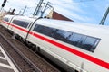 ICE 3, intercity-Express train from Deutsche Bahn passes train station Royalty Free Stock Photo