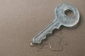 An ice key that melts on the surface. Space for text. Royalty Free Stock Photo