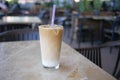 ice late coffee in a glass on cafe table Royalty Free Stock Photo