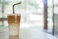 Ice latte coffee on wooden table with space for text Royalty Free Stock Photo