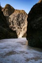 Ice layer at the bottom of the Yolyn Am or Yoliin Am canyon in spring,  Gobi Gurvansaikhan National Park. Gobi desert, Mongolia Royalty Free Stock Photo