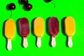 Ice lolly next to each other on a green background