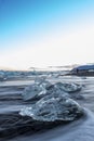 Ice lumps at a black beach